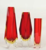 THREE MURANO SOMMERSO GLASS VASES: faceted red cased in yellow and clear, 31cms (h); another