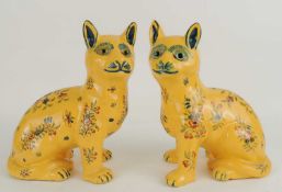 PAIR OF FRENCH FAIENCE YELLOW GLAZED CATS in the manner of Gallé, each with glass eyes painted