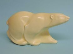SPODE'S VELAMOUR CREAM GLAZED MODEL of a polar bear, designed by Erik Olsen, 16 (h) x 33cms (l)