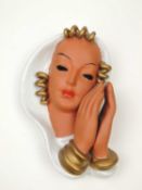 GOLDSCHEIDER ART DECO WALL MASK of a woman resting her face on her hands, cream and gold glaze, with