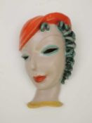 GOLDSCHEIDER ART DECO WALL MASK of a lady in an orange hat, printed backstamp and impressed marks to
