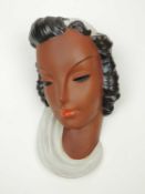 GOLDSCHEIDER ART DECO WALL MASK of a lady, black and cream glaze, original maker's label and