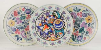 POOLE POTTERY PLAQUE, c. 2008, painted by L. Whitmarsh, 35cms (diam.); together with two floral