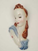 GOLDSCHEIDER ART DECO WALL MASK of a lady, brown, blue, and cream glaze, black printed backstamp and