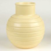 KEITH MURRAY FOR WEDGWOOD: STRAW GLAZED INCISED GLOBULAR VASE, KM factory mark, 15.5cms (h)