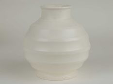 KEITH MURRAY FOR WEDGWOOD: WHITE GLAZED (MOONSTONE) RIBBED GLOBULAR VASE, KM factory mark, 16cms (h)