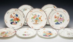 NINE THOMAS PARDOE DECORATED NANTGARW PORCELAIN PLATES, comprising near pair of non-moulded floral