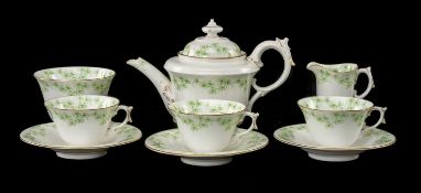 ROYAL WORCESTER PART TEA SERVICE, dated 1908, printed in green with meandering clover, gilt rims,