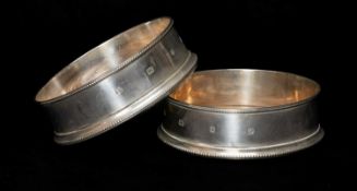 PAIR SILVER WINE BOTTLE COASTERS, M C Hersey, London 1994, 14cms (diam.) (2) Provenance: private