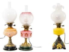 THREE OIL LAMPS to include attractive yellow & cast metal example with opaque glass shade and