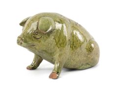 EWENNY POTTERY SLIPWARE PIG, mottled green glaze, sgraffito details and sgraffito title to side 