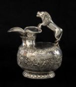 EDWARDIAN ETRUSCAN-STYLE SILVER ASKOS / WINE JUG, with rampant lion handle, the body embossed with