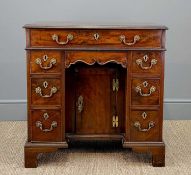 GEORGE III MAHOGANY KNEEHOLE DESK, moulded top above arrangement of seven drawers, under arch drawer