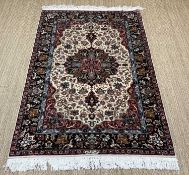 ISPHAHAN STYLE RUG, central medallion with pendants on an ivory field, madder spandrels, palmette