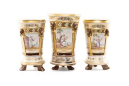 RARE COALPORT PORCELAIN GARNITURE OF THREE CACHE POTS ON STANDS, painted by Thomas Baxter with