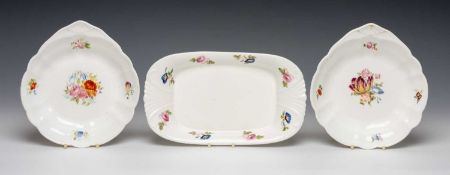THREE NANTGARW PORCELAIN DISHES, comprising pair of fan-handled circular dishes, 22cms (diam.),