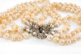 CULTURED PEARL TRIPLE-STRAND CHOKER NECKLACE, with diamond double clasp in unmarked white metal (