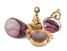 FOUR GOLD OR PLATED FOBS, including 2x 9ct amethyst glass swivel fobs, 9ct carnelian swivel fob,