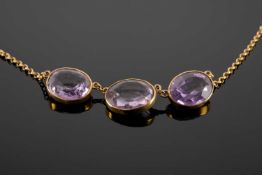 15CT GOLD THREE-STONE AMETHYST NECKLACE, stones approx. 13 x 10mms, wt. approx. 6.5g Provenance: