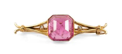 9CT GOLD TOURMALINE & DIAMOND BAR BROOCH, the central faceted domed presumed pink tourmaline stone