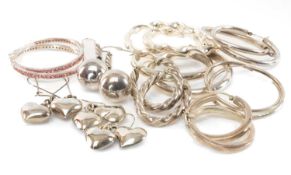 SEVEN PAIRS OF STERLING SILVER HOOP EARRINGS, largest being of twisted design, 53mms (diam.),