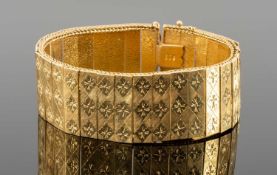 18K GOLD WIDE PANEL LINK BRACELET, bright cut decoration, 19cms, 50.0g Provenance: consigned from