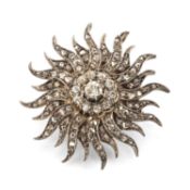 VICTORIAN DIAMOND SUNFLOWER BROOCH, centred with an oval round-cut diamond, approx. 0.2cts, bordered