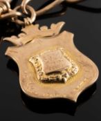 9CT GOLD LARGE CHAIN LINK WATCH ALBERT, centred with a T-bar and 9ct gold presentation shield fob,