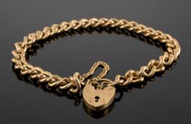 9CT GOLD CURB LINK BRACELET with padlock clasp and safety chain, 18cms (l), 17.5g Provenance: