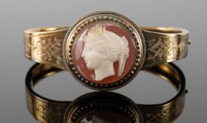 LATE VICTORIAN / EDWARDIAN CAMEO BANGLE, set with portrait cameo within beaded raised mount,