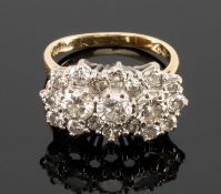 18CT GOLD DIAMOND CLUSTER RING, designed with three principal round-cut diamonds (0.8cts overall