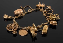 9CT GOLD CHARM BRACELET, fine fancy link chain supporting nine 9ct gold charms, and one barrel-