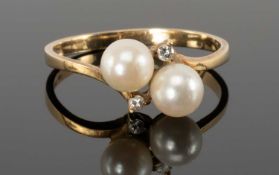 CULTURED PEARL & DIAMOND CROSSOVER RING in 14ct gold, size R, 2.3g Provenance: private collection