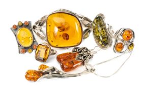 STERLING SILVER & BALTIC AMBER JEWELLERY, comprising torque bangle, four dress rings, various sizes,