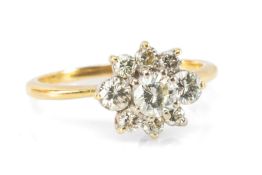 18CT GOLD DIAMOND CLUSTER RING, the central round-cut stone (0.25cts) within border of eight further