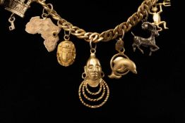 18CT GOLD DOUBLE CURB LINK NECKLACE, supporting a number of charms in 18ct gold, 9ct, and