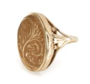 GOLD LOCKET RING, hinged oval head with scroll engraved decoration, on split shank, in unmarked