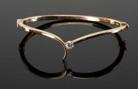 MODERN 9CT GOLD & BRILLIANT DIAMOND BANGLE, stone approx. 0.25cts, in a simple crossover mount, cuff