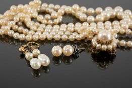 CULTURED PEARL DOUBLE-STRAND NECKLACE, with a pearl cluster clasp in 9ct gold, 52cms (l); together