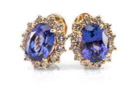 PAIR ITALIAN 14K GOLD TANZANITE EARRINGS, the ear clips each with similarly cut tanzanites of good