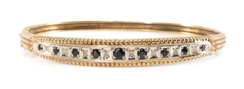 9CT GOLD DIAMOND & SAPPHIRE HINGED BANGLE, reeded setting, gross wt. 16.2g Provenance: private