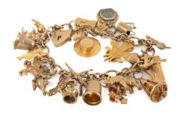 9CT GOLD CHARM BRACELET with padlock clasp and supporting twenty-four 9ct gold hallmarked and