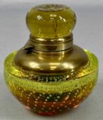 WHITEFRIARS CONTROLLED BUBBLE INKWELL in green and amber glass, squat oval form with gilded brass