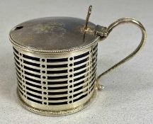 GEORGE V CIRCULAR SILVER MUSTARD POT with pierced sides and loop handle, hinged lid with pierced