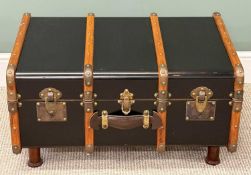 DECORATIVE WOODEN BOUND 'TRUNK' TABLE, with brass fittings, leather strap handles, and on short