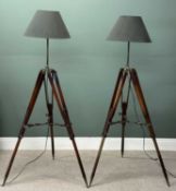 PAIR OF STYLISH STANDARD LAMPS, the adjustable wooden tripod stands having leather retaining