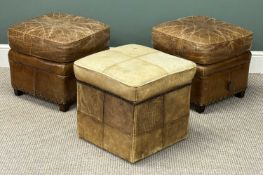 THREE BROWN HIDE UPHOLSTERED SQUARE POUFFES, a pair, and one other having studded detail, 44 (h) x