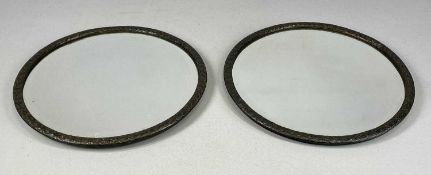 PAIR OF VINTAGE CIRCULAR WALL MIRRORS, with embossed copper frames and bevelled plates, 32.5cms (