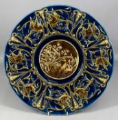 SCHUTZ BLANSKO AUSTRIAN POTTERY CHARGER, c. 1900, the central well decorated in shallow relief