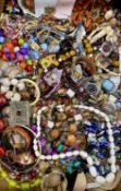 ASSORTED COSTUME JEWELLERY, including bead necklaces, various bangles, brooches, etc. Provenance: